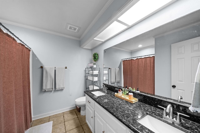 1430 Wavely St, Tyler, TX 75701 - bathroom featuring ornamental molding, toilet, double vanity, tile patterned flooring, and baseboards