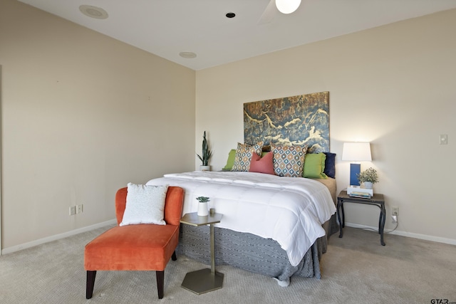 bedroom featuring carpet and baseboards
