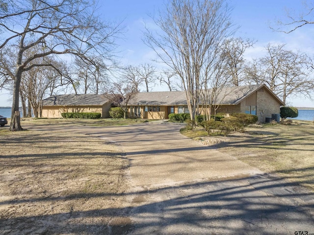 view of front of property with a water view