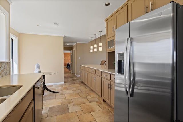 kitchen with visible vents, stainless steel appliances, light countertops, crown molding, and tasteful backsplash