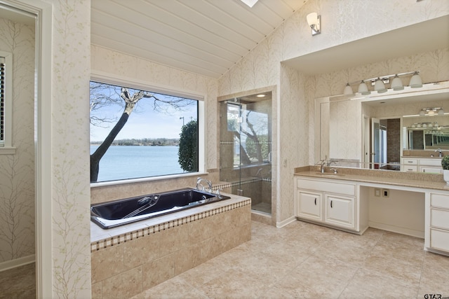 bathroom with a shower stall, wallpapered walls, lofted ceiling, a bath, and vanity