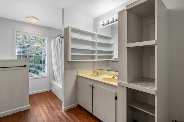 bathroom with vanity, hardwood / wood-style flooring, and shower / tub combo with curtain