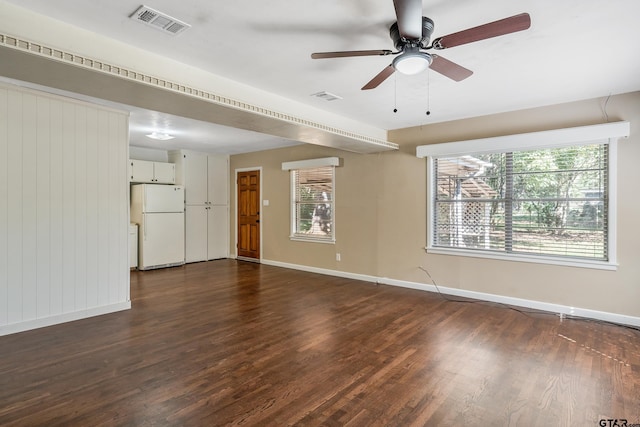 unfurnished room with dark hardwood / wood-style floors and ceiling fan