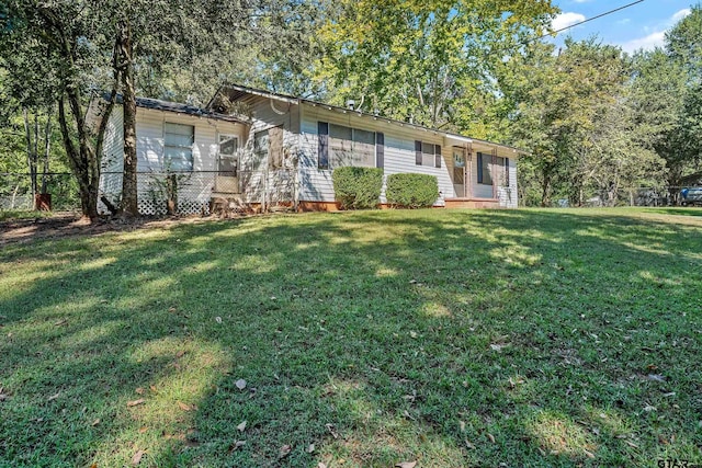 ranch-style house with a front yard