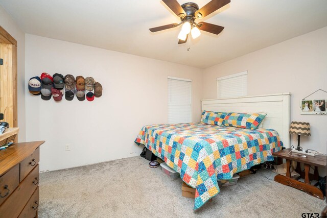 12545 Fm 968 W, Longview, TX 75602 - carpeted bedroom featuring a ceiling fan