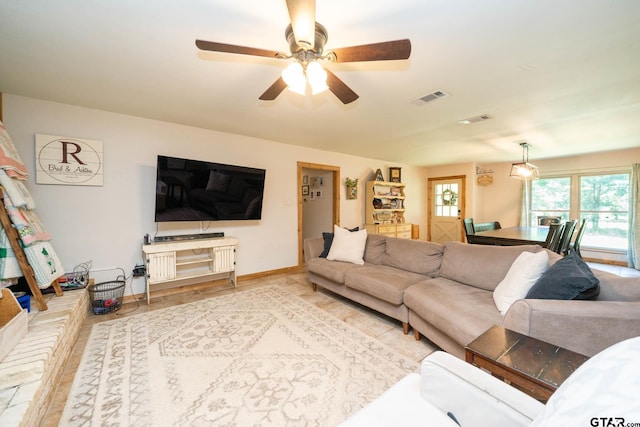 12545 Fm 968 W, Longview, TX 75602 - living area with plenty of natural light, a ceiling fan, and baseboards