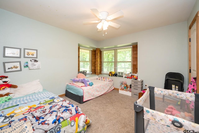 12545 Fm 968 W, Longview, TX 75602 - carpeted bedroom with a ceiling fan and baseboards