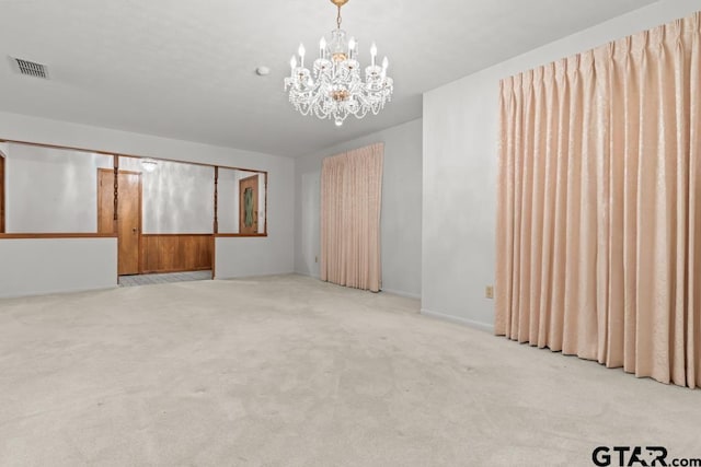 901 Dogwood St, Gilmer, TX 75644 - unfurnished room with a chandelier and carpet floors