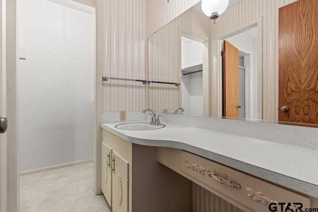901 Dogwood St, Gilmer, TX 75644 - bathroom featuring vanity and baseboards