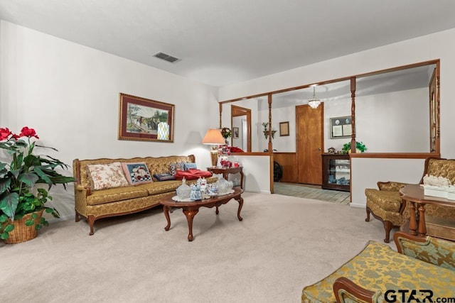 living room with light carpet and visible vents