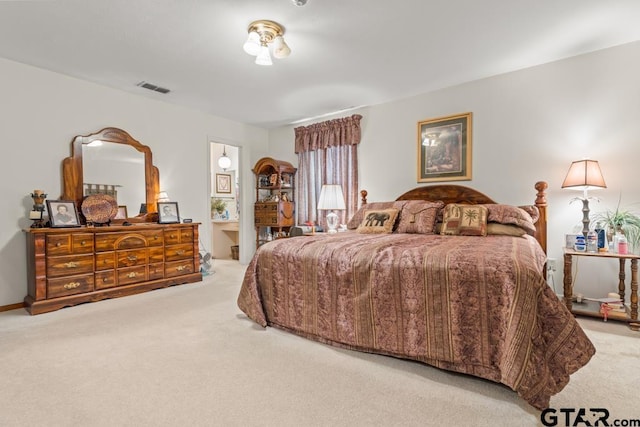 bedroom with light carpet and visible vents