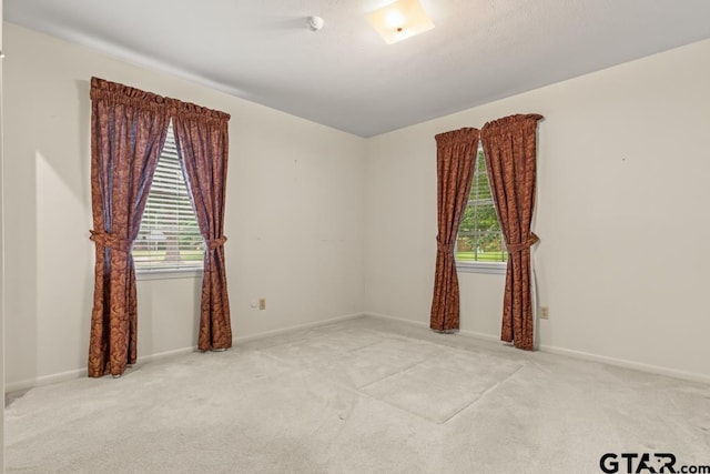 901 Dogwood St, Gilmer, TX 75644 - unfurnished room with carpet flooring and baseboards