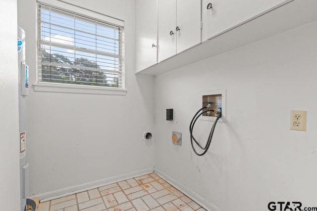 901 Dogwood St, Gilmer, TX 75644 - washroom featuring cabinet space, hookup for a washing machine, and baseboards