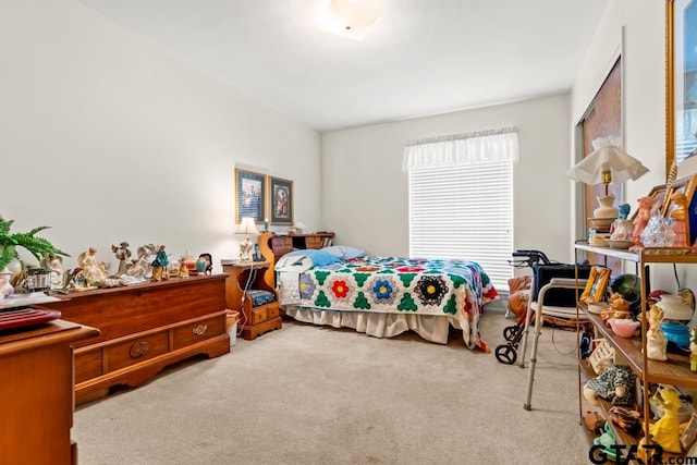 bedroom featuring light carpet