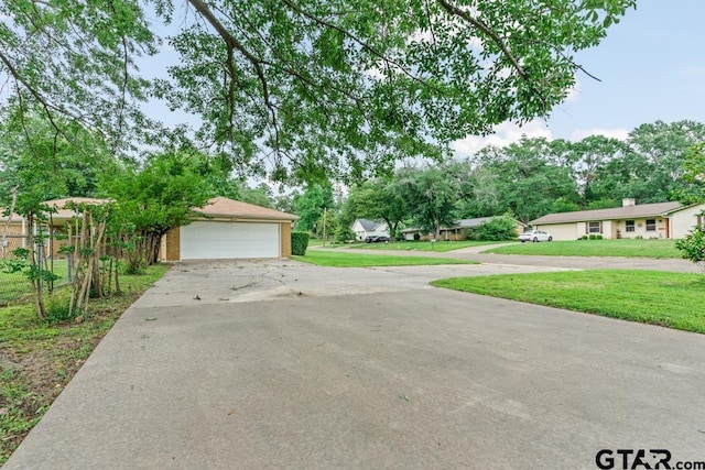 901 Dogwood St, Gilmer, TX 75644 - view of front of house with a detached garage and brick siding