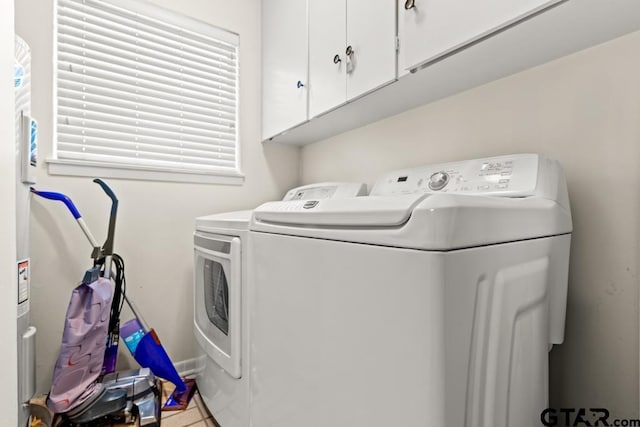 laundry room with cabinet space and washing machine and dryer