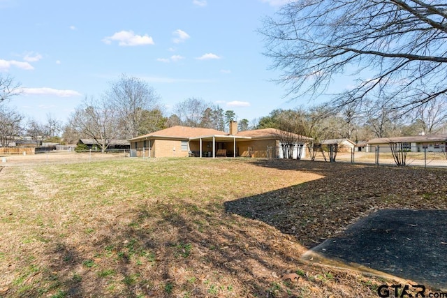 view of yard featuring fence