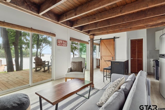 11020 Kevin Dr, Frankston, TX 75763 - living room with a water view, a barn door, wooden ceiling with exposed beams, and light wood-type flooring