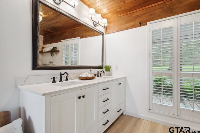 11020 Kevin Dr, Frankston, TX 75763 - bathroom with wood ceiling, double vanity, and wood finished floors