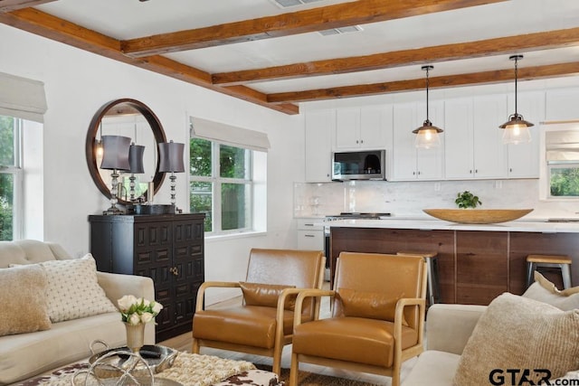 11020 Kevin Dr, Frankston, TX 75763 - kitchen featuring stainless steel appliances, open floor plan, plenty of natural light, and beam ceiling