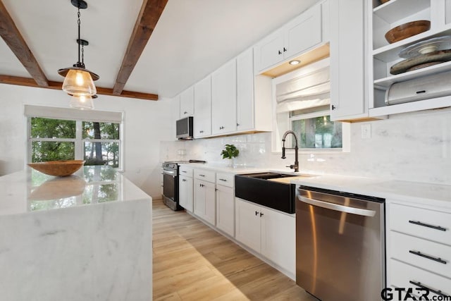 11020 Kevin Dr, Frankston, TX 75763 - kitchen featuring stainless steel appliances, a sink, decorative backsplash, white cabinets, and beamed ceiling