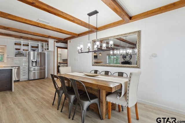 11020 Kevin Dr, Frankston, TX 75763 - dining space with beamed ceiling, light wood-type flooring, plenty of natural light, and a chandelier
