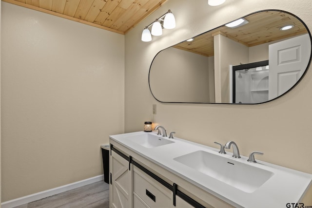 2106 Fm 1647, Winnsboro, TX 75494 - bathroom with wooden ceiling, wood finished floors, baseboards, and a sink