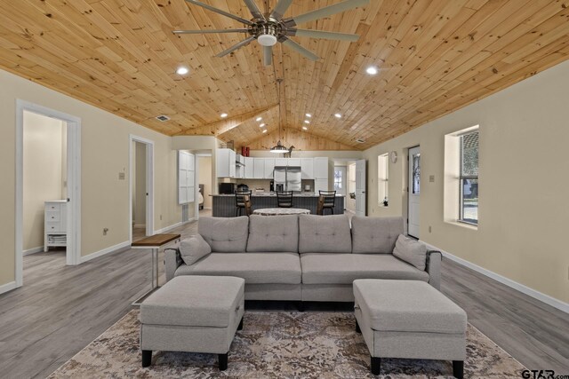 2106 Fm 1647, Winnsboro, TX 75494 - living room featuring wood finished floors, wood ceiling, and baseboards