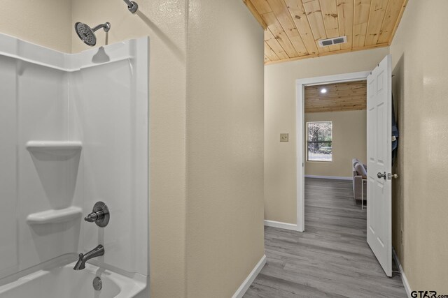 2106 Fm 1647, Winnsboro, TX 75494 - full bathroom with wood finished floors, visible vents, baseboards, wooden ceiling, and shower / bathtub combination