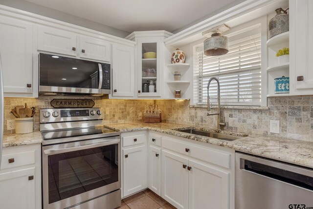 1650 Vz County Road 2512, Canton, TX 75103 - kitchen featuring appliances with stainless steel finishes, open shelves, a sink, white cabinetry, and backsplash