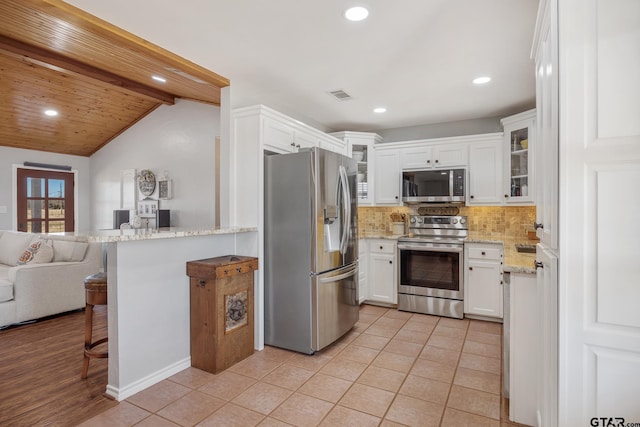 1650 Vz County Road 2512, Canton, TX 75103 - kitchen with appliances with stainless steel finishes, tasteful backsplash, white cabinets, recessed lighting, and glass insert cabinets