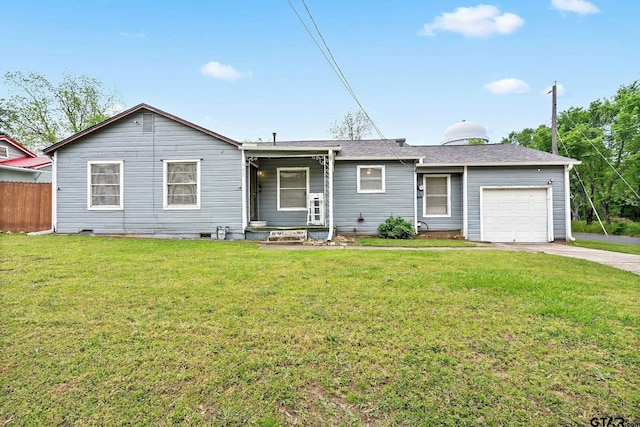 single story home with concrete driveway, fence, a front yard, and a garage