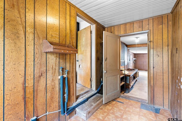 interior space featuring wood walls