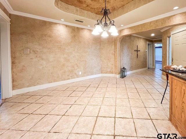 unfurnished dining area featuring ornamental molding, a chandelier, and a raised ceiling