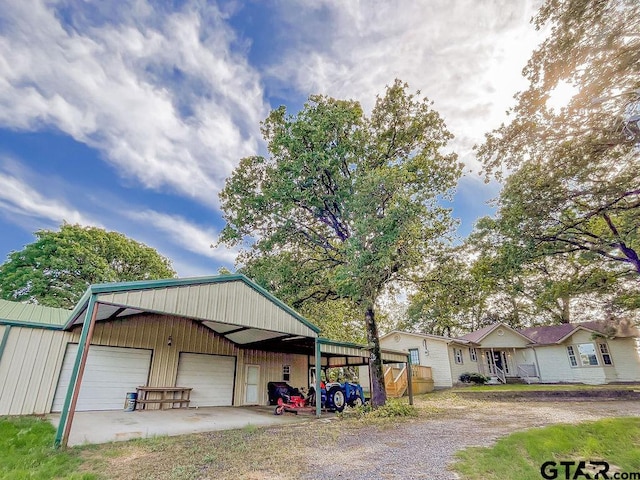 garage featuring a carport