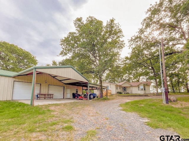 exterior space with a garage and a yard