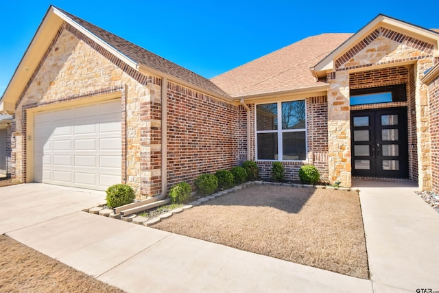 2222 Rana Park, Flint, TX 75762 - view of front of home featuring brick siding, driveway, roof with shingles, and a garage