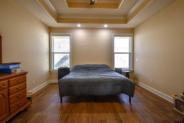 2222 Rana Park, Flint, TX 75762 - bedroom featuring crown molding, a raised ceiling, baseboards, and dark wood-style floors