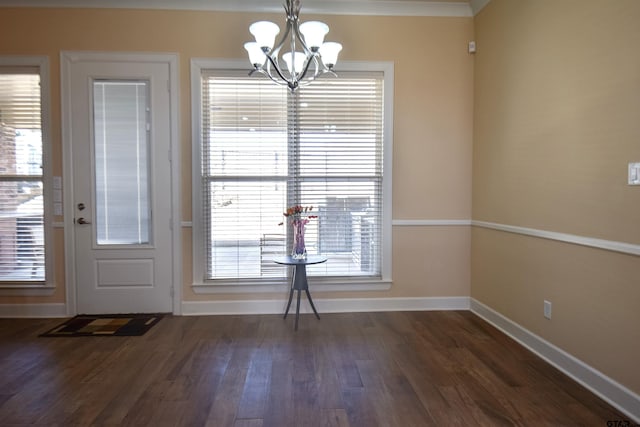 2222 Rana Park, Flint, TX 75762 - unfurnished dining area with an inviting chandelier, baseboards, dark wood-type flooring, and a healthy amount of sunlight