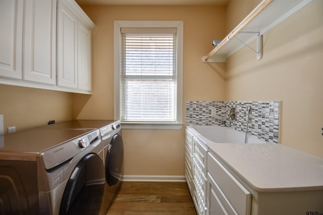 2222 Rana Park, Flint, TX 75762 - laundry room featuring baseboards, plenty of natural light, washer and clothes dryer, a sink, and cabinet space