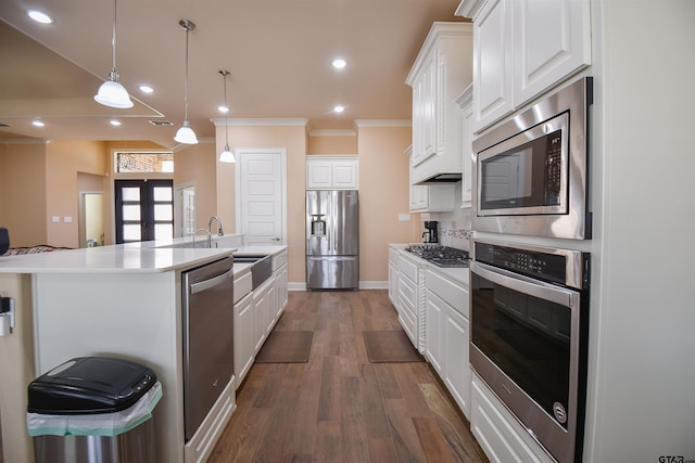 2222 Rana Park, Flint, TX 75762 - kitchen featuring crown molding, wood finished floors, light countertops, white cabinetry, and stainless steel appliances