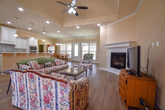 2222 Rana Park, Flint, TX 75762 - living room featuring crown molding, dark wood-style flooring, a fireplace, recessed lighting, and ceiling fan with notable chandelier