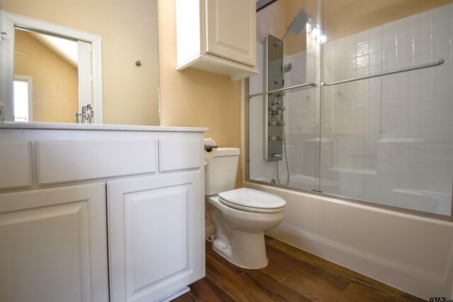 2222 Rana Park, Flint, TX 75762 - bathroom with vanity, enclosed tub / shower combo, toilet, and wood finished floors