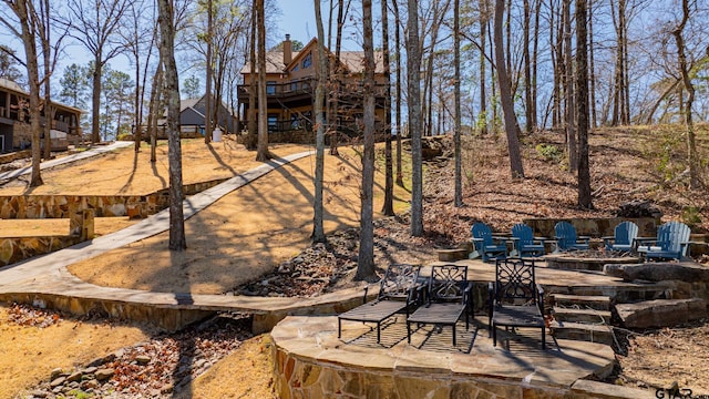 view of yard with a patio area and an outdoor fire pit