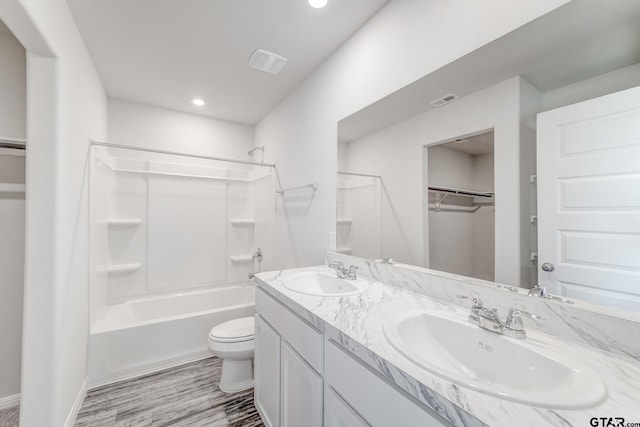 full bathroom with vanity, shower / washtub combination, and toilet