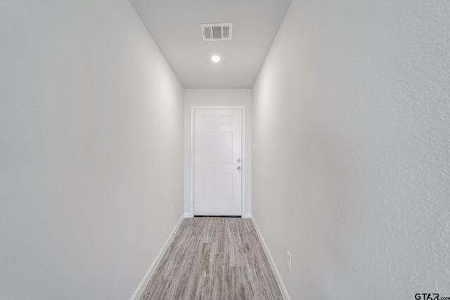 hallway featuring light hardwood / wood-style flooring