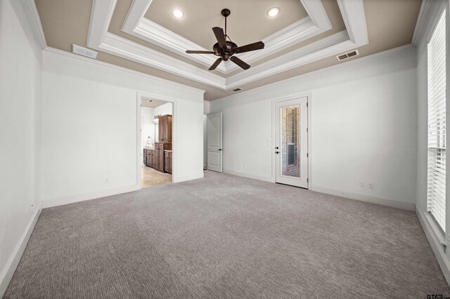 21882 Syrah Dr, Tyler, TX 75703 - unfurnished bedroom with ornamental molding, a tray ceiling, light carpet, access to exterior, and connected bathroom