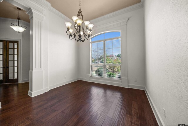 21882 Syrah Dr, Tyler, TX 75703 - unfurnished room with dark wood finished floors, a chandelier, crown molding, baseboards, and decorative columns