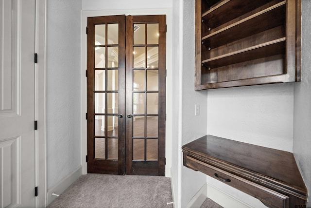 interior space featuring french doors and carpet floors