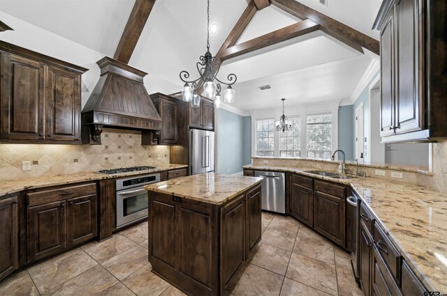 21882 Syrah Dr, Tyler, TX 75703 - kitchen featuring appliances with stainless steel finishes, a sink, custom range hood, a chandelier, and backsplash